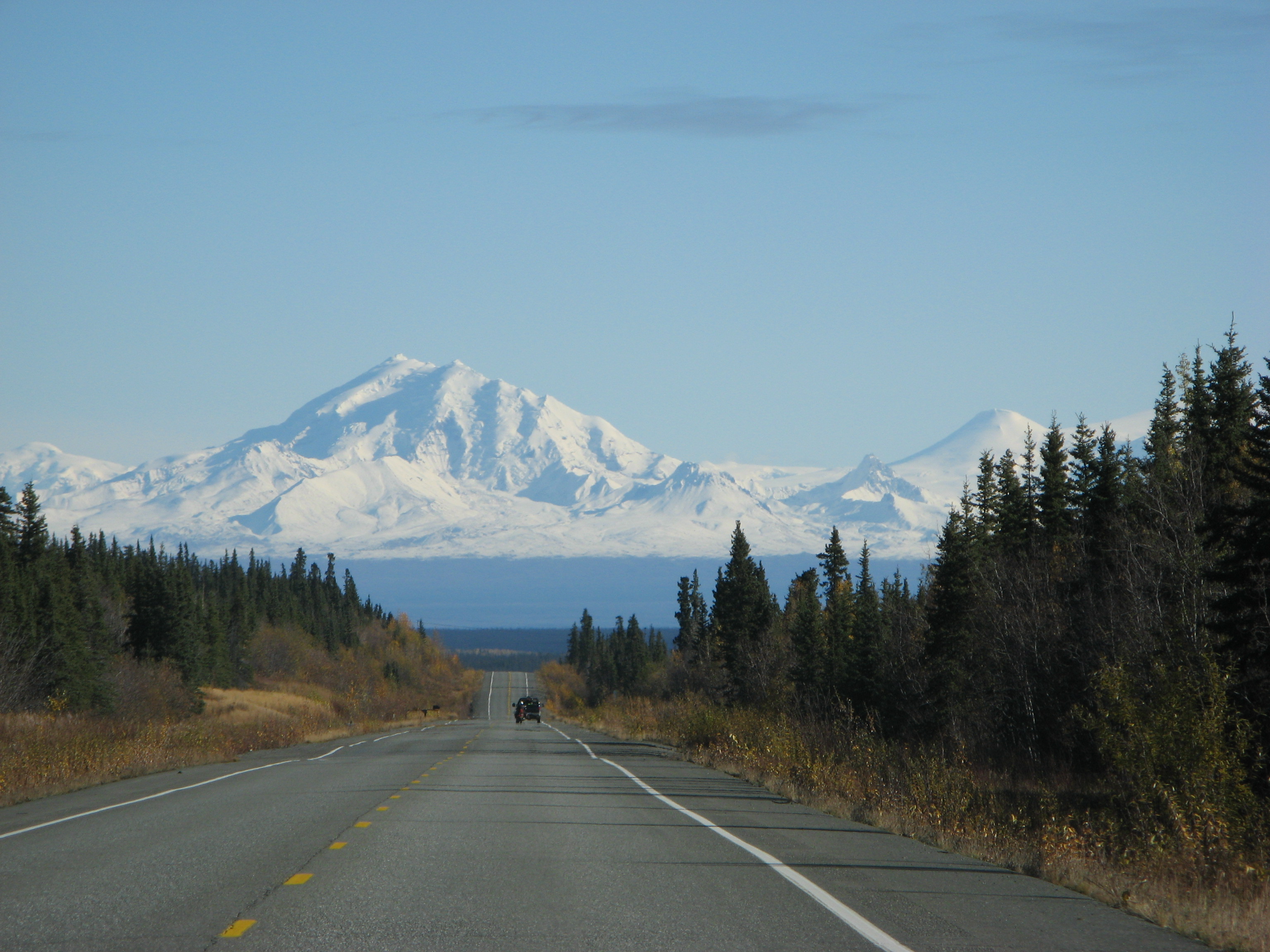 Mountain hovering over Alaska road.