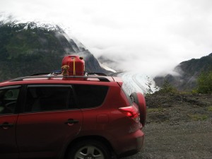 Brownie sitting on top of the car in Hyder, Alaska