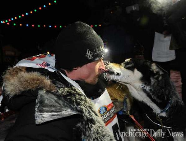 Dallas Seavey and one of his sled dogs in Nome, Alaska