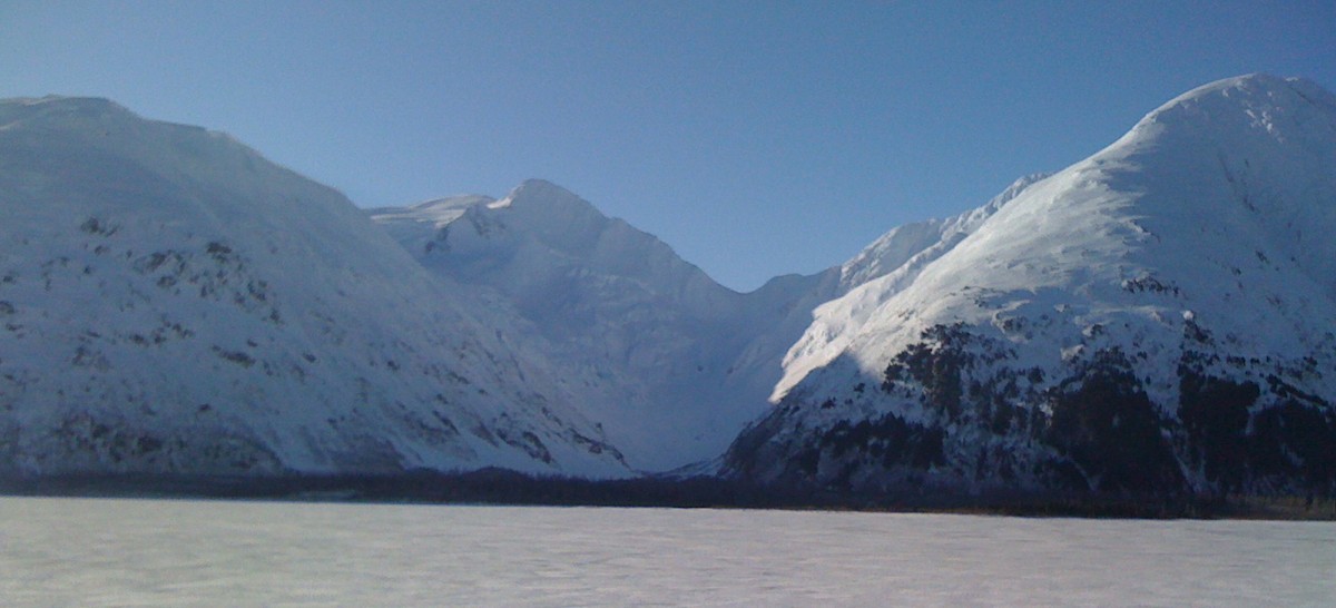 Portage, Alaska - Icy water, snow covered mountains.